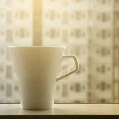 a cup of coffee near window