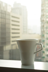 a cup of coffee near window