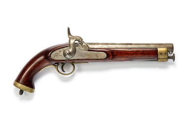 Antique wooden pistol on white