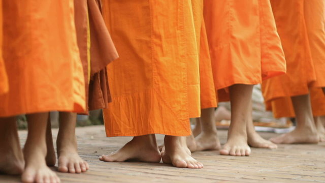 monks doing there alms rounds