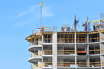 Building construction site work against blue sky