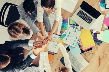 Fototapeta na wymiar Business team with hands together - teamwork concepts