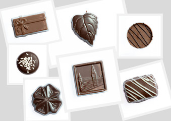 Différents bonbons en chocolat sur fond blanc