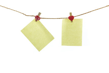 Blank paper note hanging on rope.