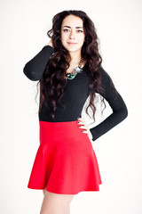 Fashion model wearing red dress and black blouse with accesory
