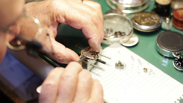 watchmaker assembles a watch