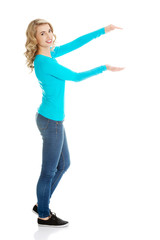 Woman showing something or copyspase