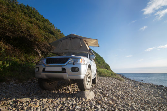 Car With Rooftop Tent On It