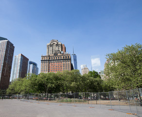 New York City, Battery Park area. Trees and Skyscrapers on a sun