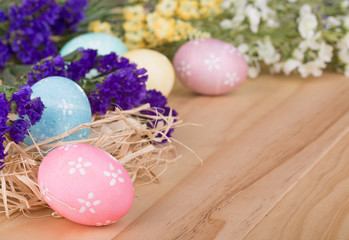 Obraz na płótnie Canvas Colorful Easter Eggs and Flowers