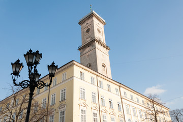 Fototapeta na wymiar City Hall and lamppost on Lviv central Market Square
