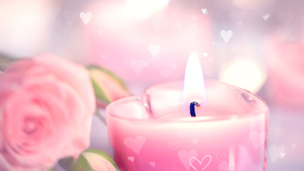 Valentine's Day. Pink heart shaped candles and rose flowers