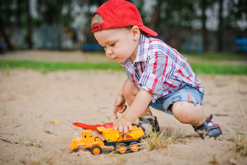 child plays with sand