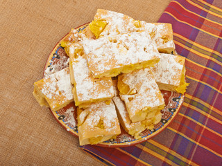 Homemade cake orange apple charlotte on tablecloths and canvas