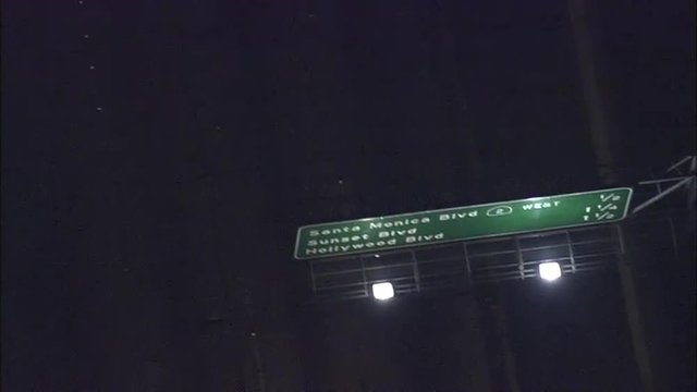 freeway sign night cars