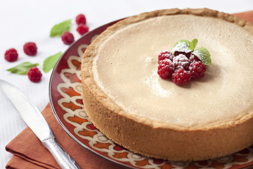 Coffee and cream cake with raspberries