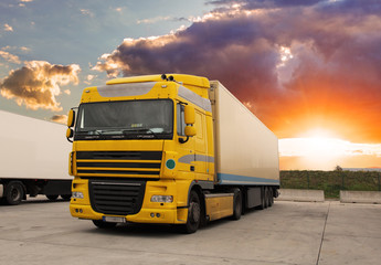 Fototapeta na wymiar Truck - cargo transportation with sun