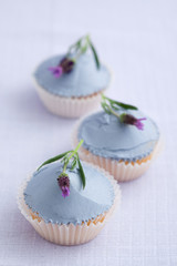 Three lavender cupcakes