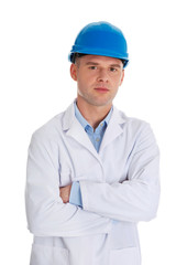 Man in a lab coat and helmet