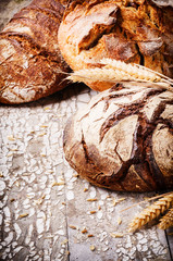 Selection of freshly baked bread in rustic setting