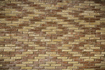 red and yellow brick wall with pattern