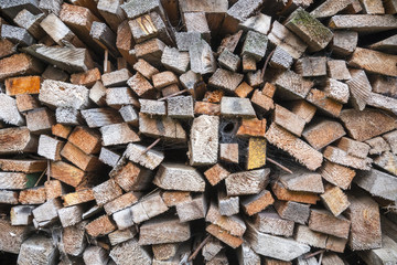 close up of a stack of timber with rusty nails