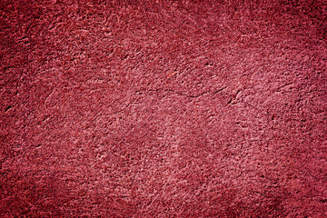 Red stone grunge background wall texture