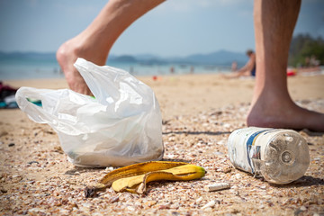 Garbage on a beach left by tourists, environmental pollution concept.