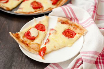 Italian pizza with mozzarella cheese and tomatoes, Margarita