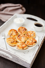 Delicious homemade cheese pancakes with coffee