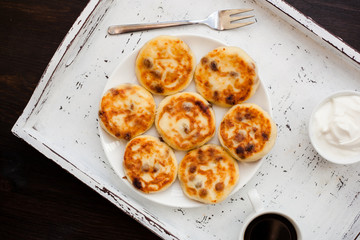 Delicious homemade cheese pancakes with coffee