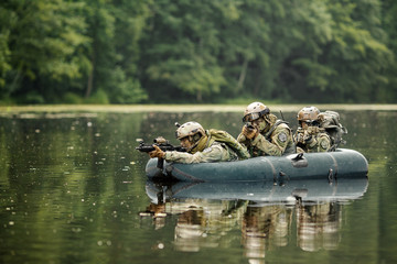 soldiers in a boat sailing ahead