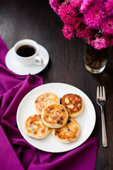 Delicious homemade cheese pancakes with black coffee
