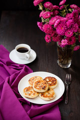 Delicious homemade cheese pancakes with black coffee