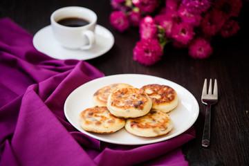 Delicious homemade cheese pancakes with black coffee