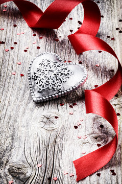Valentine's setting with decorative heart and red ribbon