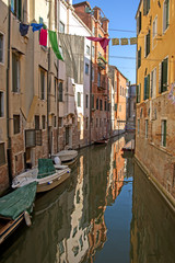Fototapeta na wymiar Venice - buildings, drying clothes and docked boats.