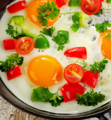 Fried eggs and vegetables