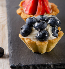 Sweet cakes with fresh  berries.