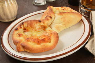 Folded pizza with beer