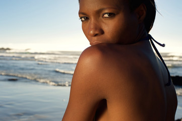 african female fashion model posing at the beach