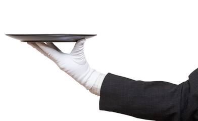 side view of hand in white glove with black plate