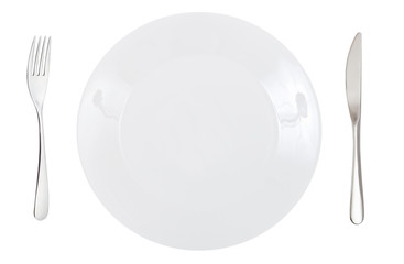 top view of porcelain dinner plate with cutlery