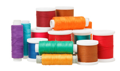 multicolored thread spools isolated on white