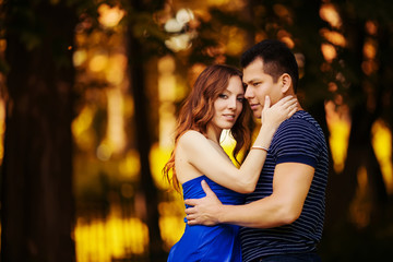 Fototapeta premium loving couple are hugging in park
