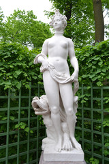 Fototapeta na wymiar Statue Allegory of Beauty in Summer Garden.