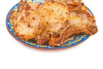 Grilled pork veal on a plate isolated on white background