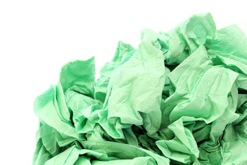 Green crumpled toilet paper on white