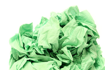 Green crumpled toilet paper on white