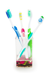 colorful family toothbrushes isolated on white background